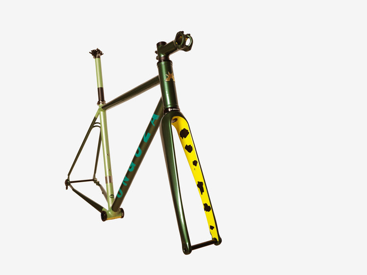 Boomslang Green Holy Fire frameset (frame, fork, stem, seatpost, headset) from the front-side view. Showcases the yellow cow-print paint inside the carbon fork. The seat tube is a pearled Sage color, including the seat post. The front and rear triangles are in a dark forrest (British racing) green, the ONGUZA word mark is in a teal blue-green.